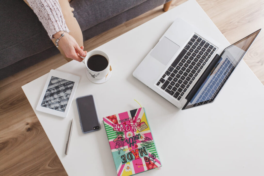 Best side hustles in the UK and USA in 2026 showing online income ideas, laptop workspace and digital earning opportunities