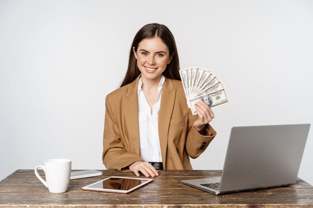 Beginner making first $100 online using laptop with digital income dashboard and online earning methods